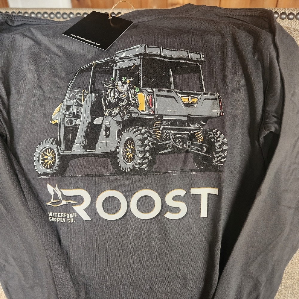 YOUTH LARGE BRAND NEW, WITH TAG ATTACHED, LONG SLEEVE GREY "THE ROOST" TSHIRT.